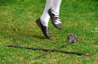 sword dancing - a highland dancer dancing over swords, by Charles Wordingham